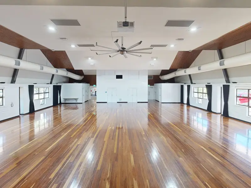 Spacious training hall with polished wooden floors at ATI Martial Arts Coolum.